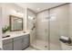 Modern bathroom with a glass-enclosed shower, sleek vanity, and neutral color scheme at 2068 Cortland Rd, Milton, GA 30009