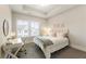 Cozy bedroom with a neutral palette, bright window, and modern decor at 2068 Cortland Rd, Milton, GA 30009