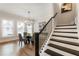 Dining room with modern chandelier and staircase at 2068 Cortland Rd, Milton, GA 30009