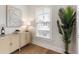 Modern dining room with buffet and large plant, natural light at 2068 Cortland Rd, Milton, GA 30009