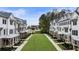 An aerial view of modern townhomes with a central green space at 2068 Cortland Rd, Milton, GA 30009