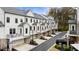 An exterior view of modern townhomes with garages and black trim at 2068 Cortland Rd, Milton, GA 30009