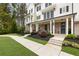 Well-manicured front yard with lush green lawn, walkway, and a covered porch at 2068 Cortland Rd, Milton, GA 30009