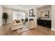 Bright living room with modern fireplace, stylish decor, hardwood floors and natural light at 2068 Cortland Rd, Milton, GA 30009