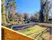 Fenced in backyard with a pond and mature trees for privacy at 2152 Castlewood St, East Point, GA 30344