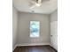 Simple bedroom with light gray walls, hardwood floors, and a window at 2152 Castlewood St, East Point, GA 30344