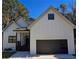 Charming new construction with board and batten siding and a two car attached garage at 2152 Castlewood St, East Point, GA 30344
