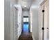 Bright hallway with wood floors and multiple doors at 2152 Castlewood St, East Point, GA 30344