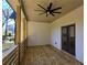 Covered porch with a ceiling fan and view of the treelined backyard at 2152 Castlewood St, East Point, GA 30344