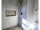 Modern tiled shower featuring a built-in niche and sleek, matte black hardware at 2152 Castlewood St, East Point, GA 30344