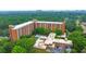 A high-angle shot revealing the apartment complex nestled among verdant trees, complete with a refreshing community pool at 300 Johnson Ferry Ne Rd # A1008, Atlanta, GA 30328