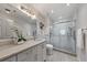 An elegant bathroom features marble countertop, vanity, and glass enclosed shower at 300 Johnson Ferry Ne Rd # A1008, Atlanta, GA 30328