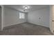 A simple bedroom with a window and light colored walls and carpet at 300 Johnson Ferry Ne Rd # A1008, Atlanta, GA 30328