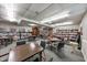 Bright game room with tables, chairs, board games, and a ceiling fan for relaxing and entertaining at 300 Johnson Ferry Ne Rd # A1008, Atlanta, GA 30328
