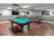 A game room with a pool table, ping pong table, and a large TV for entertainment and relaxation at 300 Johnson Ferry Ne Rd # A1008, Atlanta, GA 30328