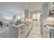 Modern kitchen with white cabinets, marble countertops, a stylish backsplash, and stainless appliances at 300 Johnson Ferry Ne Rd # A1008, Atlanta, GA 30328