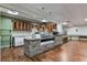 A well-lit kitchenette features a stone counter, wooden cabinets, and modern appliances for a pleasant dining experience at 300 Johnson Ferry Ne Rd # A1008, Atlanta, GA 30328