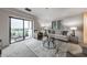 Bright living room with sliding glass doors to a balcony and contemporary furnishings at 300 Johnson Ferry Ne Rd # A1008, Atlanta, GA 30328