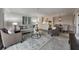 Spacious living room with neutral color palette, comfortable seating, and view of the kitchen and dining room at 300 Johnson Ferry Ne Rd # A1008, Atlanta, GA 30328