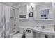 Bathroom featuring a shower-tub combo, decorative shower curtain, and classic sink at 8 Arpege Nw Way, Atlanta, GA 30327