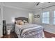 Cozy bedroom with great natural light, calming colors, and hardwood floors at 8 Arpege Nw Way, Atlanta, GA 30327