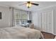 Bedroom with carpet, white trim, and a large window with great natural light for working at home at 8 Arpege Nw Way, Atlanta, GA 30327