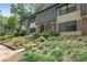 Charming townhouse featuring well-maintained landscaping and inviting entrance at 8 Arpege Nw Way, Atlanta, GA 30327