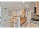 Well-lit kitchen showcases modern cabinets, countertop space, and breakfast bar area at 8 Arpege Nw Way, Atlanta, GA 30327