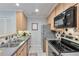 Stylish kitchen features stainless steel appliances and elegant backsplash design at 8 Arpege Nw Way, Atlanta, GA 30327
