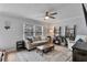 Bright living room with large windows, stylish furnishings, and cozy ambiance at 8 Arpege Nw Way, Atlanta, GA 30327