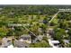 An aerial view shows the home's location near Ansley Golf Club amidst lush greenery at 219 Little John Ne Trl, Atlanta, GA 30309