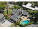 Aerial view of a home with a backyard pool, lounge area, privacy fence, and well-maintained lawn at 219 Little John Ne Trl, Atlanta, GA 30309