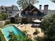 Stunning backyard with in-ground pool, stone patio, lounge chairs, and outdoor seating area at 219 Little John Ne Trl, Atlanta, GA 30309