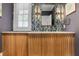 Stylish powder room with wood vanity, decorative wall tiles, and stone countertop at 219 Little John Ne Trl, Atlanta, GA 30309