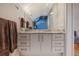 Bathroom vanity featuring gray cabinets, marble countertop, and large mirror at 219 Little John Ne Trl, Atlanta, GA 30309