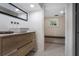 Modern bathroom with stylish vanity, vessel sink, and a view into a sauna at 219 Little John Ne Trl, Atlanta, GA 30309