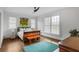 Serene bedroom with hardwood floors, large window, and natural light at 219 Little John Ne Trl, Atlanta, GA 30309