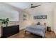 Comfortable bedroom featuring hardwood floors, neutral walls, and lots of natural light at 219 Little John Ne Trl, Atlanta, GA 30309