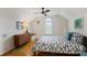 A cozy bedroom features sloped ceilings, a striking patterned floor, and a built-in window seat at 219 Little John Ne Trl, Atlanta, GA 30309