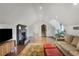 Upstairs bonus room with vaulted ceilings, fireplace, built-in shelving, and plenty of natural light at 219 Little John Ne Trl, Atlanta, GA 30309
