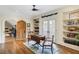 Charming bonus room with vaulted ceilings, hardwood floors, built-in shelving, and arched doorway at 219 Little John Ne Trl, Atlanta, GA 30309