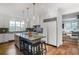 Modern kitchen featuring a center island with pendant lighting, stainless steel appliances, and hardwood floors at 219 Little John Ne Trl, Atlanta, GA 30309