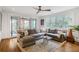 Cozy living room featuring a comfortable sectional sofa, area rug, and ample natural light at 219 Little John Ne Trl, Atlanta, GA 30309