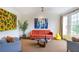 Bright living room featuring modern art, stylish furniture, and large windows offering natural light and pleasing views at 219 Little John Ne Trl, Atlanta, GA 30309