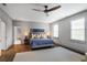 Spacious main bedroom featuring hardwood floors, neutral walls, and large windows for ample natural light at 219 Little John Ne Trl, Atlanta, GA 30309