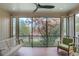 Relaxing screened porch with swing, seating, and beautiful outdoor views at 219 Little John Ne Trl, Atlanta, GA 30309