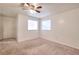 Bedroom with carpet, neutral walls and two windows at 6502 Wellington Chase Ct, Lithonia, GA 30058
