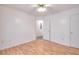 Bedroom with neutral walls, hardwood floors, and two white doors at 6502 Wellington Chase Ct, Lithonia, GA 30058