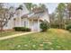 Charming home exterior with a well-kept lawn, lovely shrubbery, and a cozy, covered entryway at 6502 Wellington Chase Ct, Lithonia, GA 30058