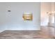 Bright and airy living space with hardwood floors, a pass-through to the kitchen, and an open layout at 6502 Wellington Chase Ct, Lithonia, GA 30058